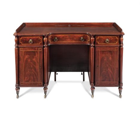 A REGENCY MAHOGANY DRESSING TABLEATTRIBUTED TO GILLOWS, CIRCA 1815With a sash-rising mirror to the top, the front parquetry b