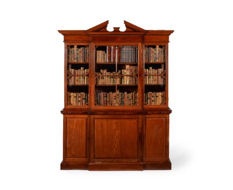 A MAHOGANY BREAKFRONT LIBRARY BOOKCASE 18TH CENTURY AND LATERWith architectural pediment, the breakfront brushing slide with 