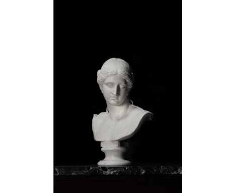 AN ITALIAN CARRARA MARBLE LIFE SIZE BUST OF AN AMAZON LATE 18TH CENTURY Head tilted to left, titled to plinth "AMAZONNE", pol