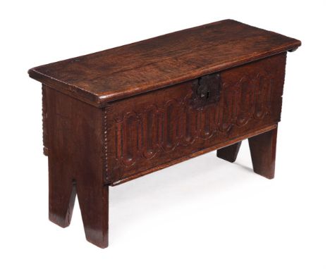 A JAMES I BOARDED OAK CHILD'S CHEST OR COFFERCIRCA 1620Of small proportions, with unusual channelled and stylised architectur