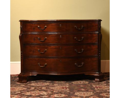 A GEORGE III MAHOGANY SERPENTINE COMMODE IN THE MANNER OF THOMAS CHIPPENDALE, CIRCA 1770 The top drawer fitted with a tooled 