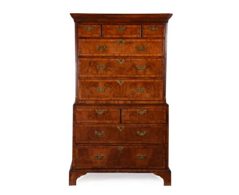 A GEORGE II WALNUT AND FEATHERBANDED CHEST ON CHESTCIRCA 1730182cm high, 107.5cm wide, 57cm deepProvenance: Howth Castle, Cou