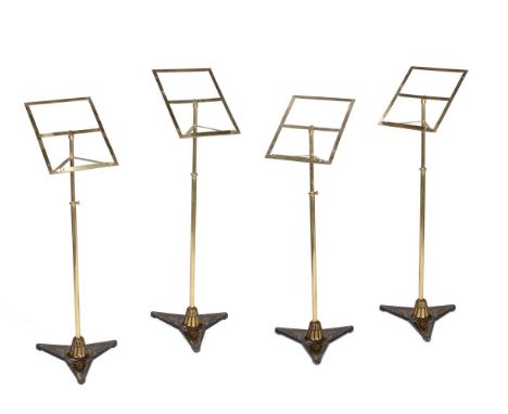 A SET OF FOUR BRASS AND CAST IRON MUSIC STANDSIN THE STYLE OF SEBASTIAN ERAD, EARLY 20TH CENTURYThe adjustable poles on trifi