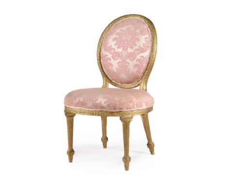 A GEORGE III CARVED GILTWOOD SIDE CHAIR IN THE MANNER OF THOMAS CHIPPENDALE, CIRCA 1775 Upholstered in pink damask, with v-sh