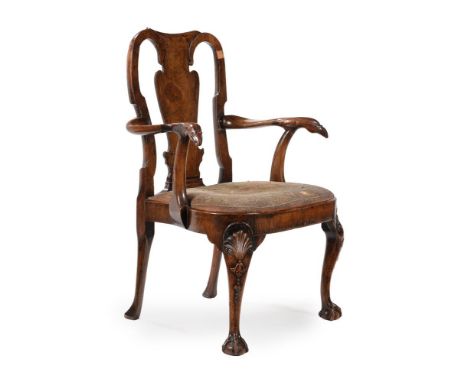 A GEORGE II WALNUT OPEN ARMCHAIR IN THE MANNER OF GILES GRENDEY, CIRCA 1735With 18th century needlework seat96cm high, 70cm w