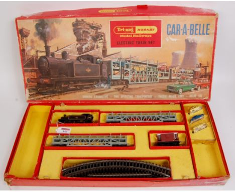 A Triang Hornby RS62 Car-A-Belle train set containing Jinty tank engine, brake van, 2 Tierwag car transporter wagons, 7 Minix