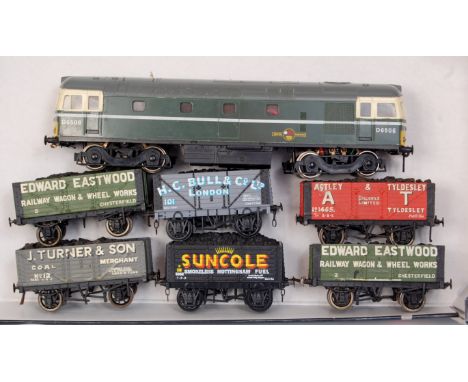 A small tray containing Lima green BR Class 33 loco no. D6506 fitted with 2 motors, 4 x kitbuilt open coal wagons and 2 x "Sk