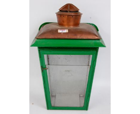 A Midland Railway style fence mounting oil lamp case, partly restored together  with a LMS marked oil lamp reservoir and glas