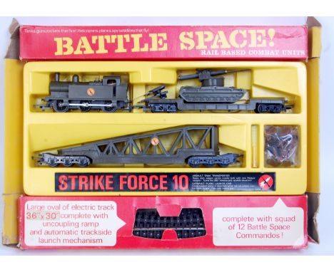 A Triang Hornby Battle Space 'Strike Force 10' train set containing Jinty tank engine, assault tank transformer missing missi