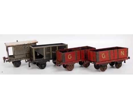 4 GI items of rolling stock including Marklin Midland Goods van, Bing 20 tons hopper wagon, and 2x Bing GN open wagons (all F