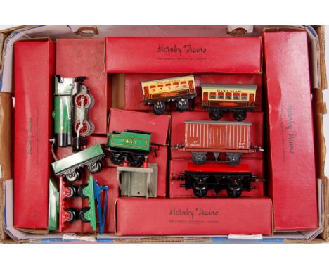 A large tray containing a collection of mint boxed Hornby postwar items from shop clearance including green M1 loco and 3435 