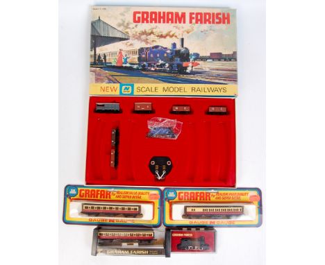A Graham Farish N gauge NGSI GER blue tank loco goods set, missing track (G-BG), a similar tank engine black (G-BG), 3 maroon