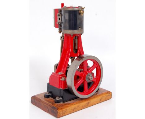 A well made Stuart Type vertical steam engine, comprising of single cylinder raised on A frame supports, fitted with slip ecc