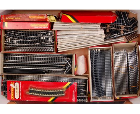 Quantity of Hornby straight and curved track and points, 2 controllers, clockwork tank engine and three wagons etc (G)