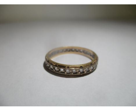 An 18ct gold full eternity ring inset with paste stones, 2gLocation: 