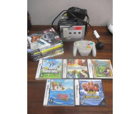 A Nintendo Game Cube with hand console, and a group of games to include Killer7 and Metroid (Viewtful Joe and Tales of Sympho
