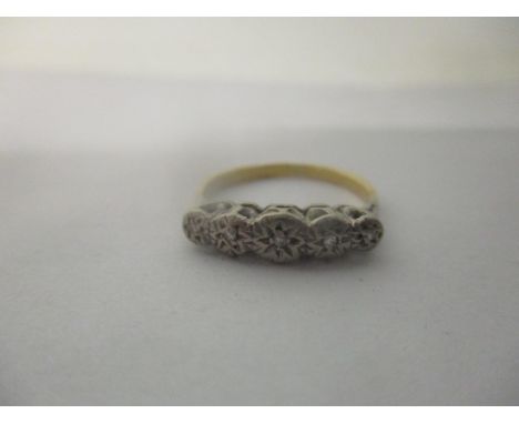 A yellow metal ring with five illusion inset diamonds, 3gLocation: 