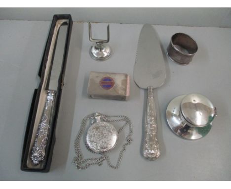 Silver to include a Kings pattern bread knife and slice with stainless steel blades, an Electric Company matchbox holder insc