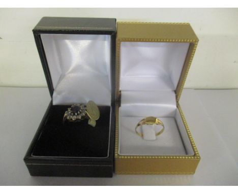 A 9ct gold ring set with a sapphire coloured cabochons and white stones and a 9ct gold child's ring, 3.15gLocation: 