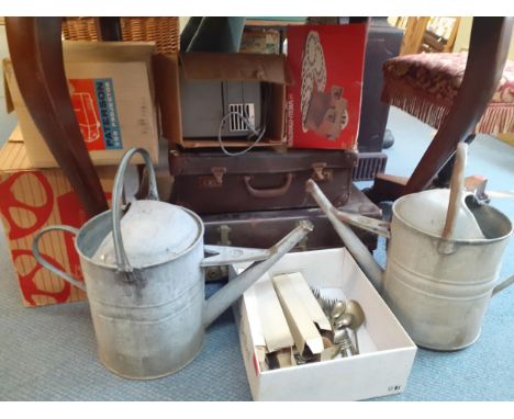 A quantity of vintage items to include cutlery, flatware, watering cans, projectors, a projector screen and a ViewmasterLocat