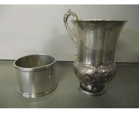 An early 20th century silver napkin ring, together with a white metal thistle engraved cup 88.2g Location: 