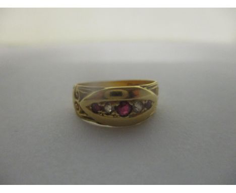 An 18ct gold gypsy ring inset with rubies and diamonds, 3.4gLocation: 