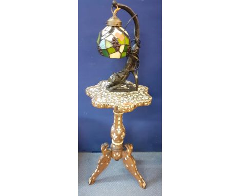 An Eastern mother of pearl and bone inlaid occasional table on pedestal base together with a Tiffany style lamp, the support 