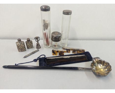 A mixed lot of silver items to include silver lidded dressing table bottles, combe, toddy ladle and other itemsLocation: cab 