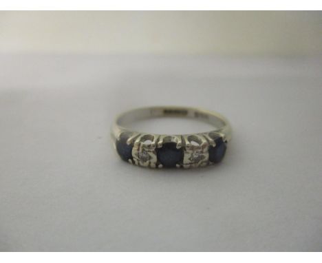 A 9ct white gold ring inset with sapphires and diamonds, 2.4gLocation: 