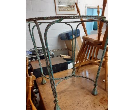 A garden wrought iron painted table and two chairs of rope twist design (no table top) together with metal twin handled trunk