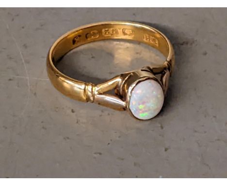 A 22ct gold ring set with an oval opal size R 4.2g Location: 