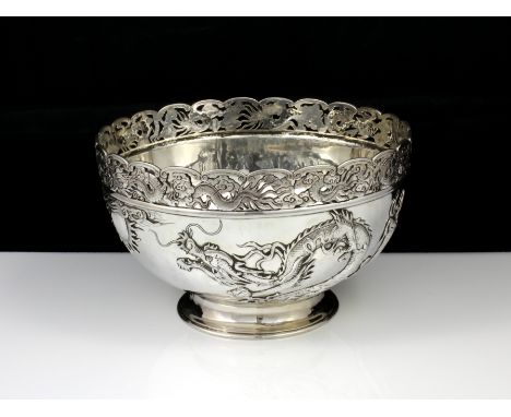 An antique Qing dynasty Chinese export Silver dragon bowl by Wang Hing & Co of Hong Kong circa 1890. Of exceptional quality, 