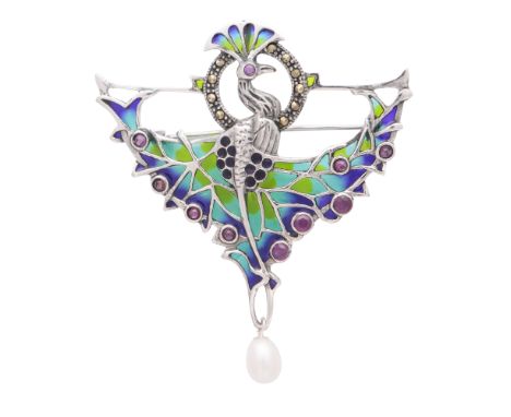 A plique a jour enamel and pearl pendant / brooch in sterling silver depicting a peacock with its tail feathers splayed. With