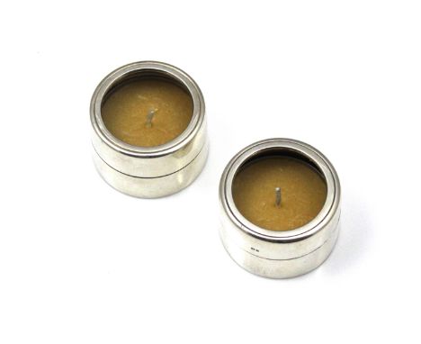 A pair of vintage Elizabeth II Sterling Silver tea light / candle holders by Roger John Squires, London 1984. Of plain circul