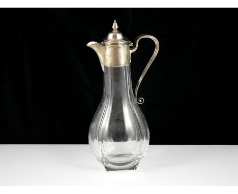 An antique Victorian Sterling Silver mounted claret jug by Martin, Hall & Co, Sheffield 1889. The rounded, square glass body 