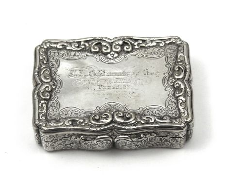 An antique Victorian Sterling Silver table snuff box by Nathaniel Mills, Birmingham 1847. Of rectangular form with serpentine