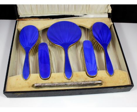 An antique George V Sterling Silver gilt ladies vanity / dresser set by David, Moss & Co, Birmingham 1931. Comprising six pie