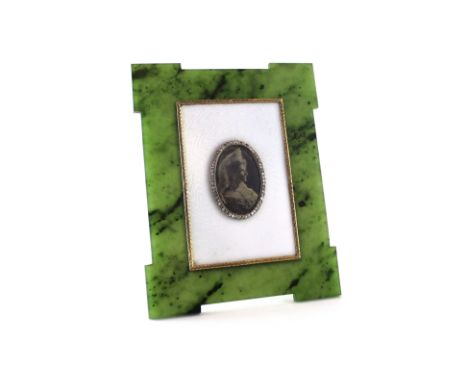 FABERGE An antique Imperial Russian jewelled gold, nephrite and enamel photograph frame by Faberge, marked with Faberge in cy