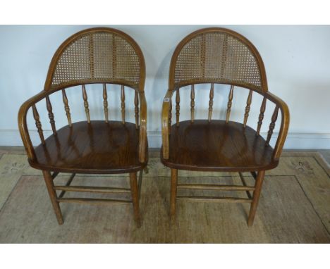 A pair of hoop back armchairs with carved back and bobbin supports, 92cm tall 