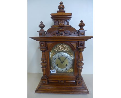 A 19th century German walnut cased bracket/mantel clock by Junghams with 8 day movement striking on hour and each quarter, fu