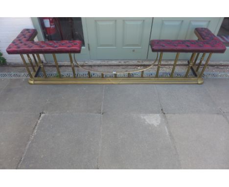 A large Victorian style brass club fender with maroon button leather top, 53cm tall x 229cm x 49cm 