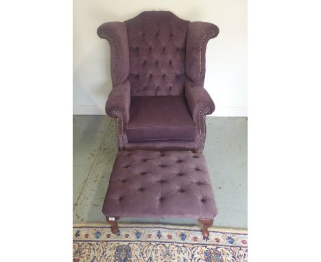 A Georgian style button back wing armchair, with matching stool 