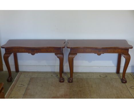 A pair of walnut serpentine fronted console tables with ball and claw fore legs, approx 120cm W x 75cm H x 52cm D - made by a