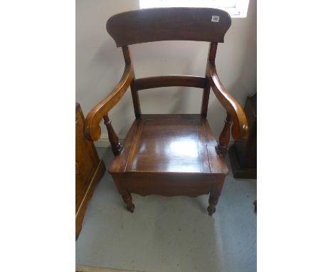 A  mahogany commode armchair 