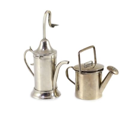 A George V silver novelty atomiser modelled as a pouring vessel, London, 1914, 12.3cm and a novelty silver compact?,modelled 