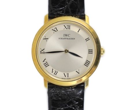 A gentleman's 18ct gold International Watch Company manual wind dress wrist watch,on an IWC leather strap with 18ct gold buck