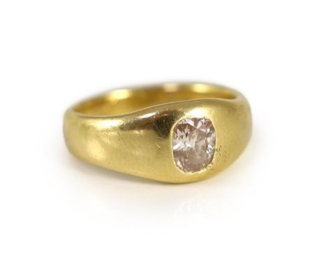 A Victorian 18ct gold and gypsy set oval cushion cut diamond set ring,the stone measuring approximately 6.4mm by 5.4mm, with 