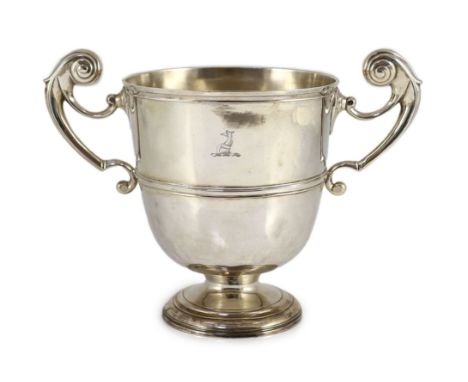 A George II Irish silver two handled presentation trophy cup, maker's mark rubbed,with engraved crest, banded girdle and late