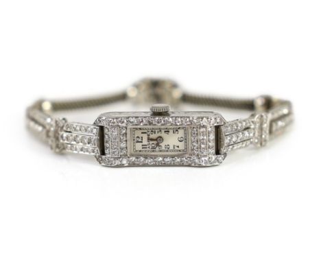 A lady's mid 20th century platinum and diamond set manual wind cocktail watch, retailed by Asprey,with rectangular Arabic dia