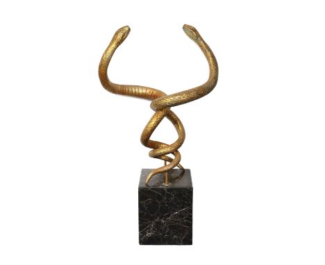 After Edgar Brandt. A gilt cast iron group of two entwined snakes,raised upon a marble plinthwidth 66cm height 121cmOverall l